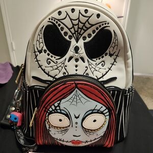 Stylish Black and White Backpack with Red Accents